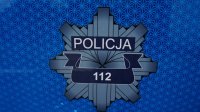 Napis :POLICJA&quot; 112- w policyjnej gwieździe.