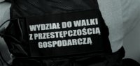 Napis: Wydział do Walki z Przestępczością Gospodarczą.