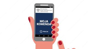 Grafika przedstawiająca telefon komórkowy. Na ekranie napis Moja Komenda.