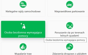 Widok strony internetowej Krajowej Mapy Zagrożeń Bezpieczeństwa. Na zielonym tle zakładka  z napisem o treści osoba bezdomna wymagająca pomocy